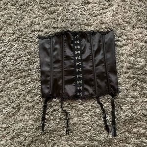Women’s black satin corset.